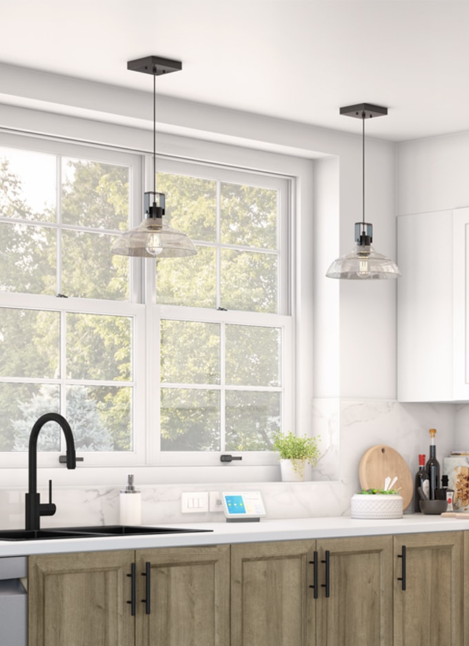 Hanging lights over a kitchen faucet
