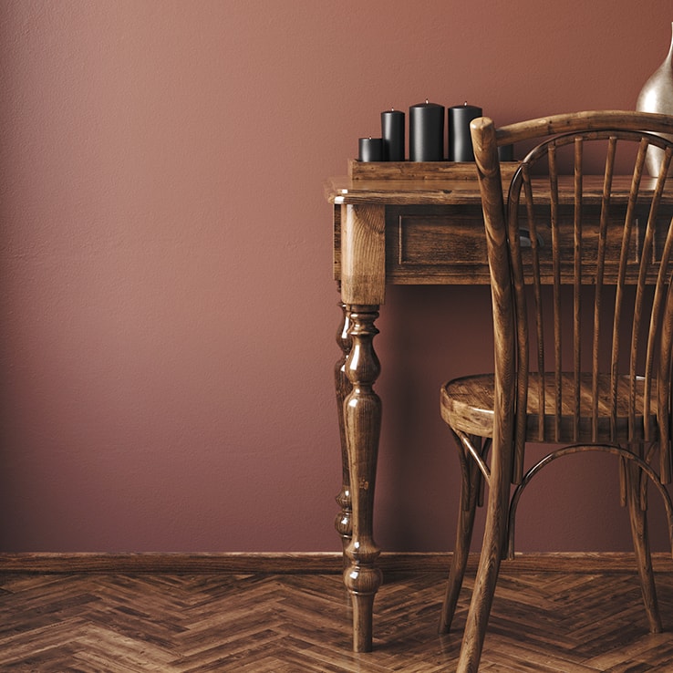 Room with antique furniture and chevron flooring