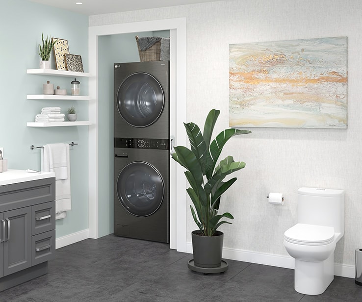 Stacked washer and dryer in a bathroom closet