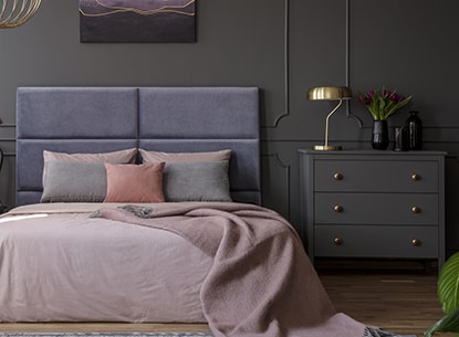 Elegant bedroom with very dark walls
