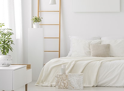 Cosy bedroom with all-white decor