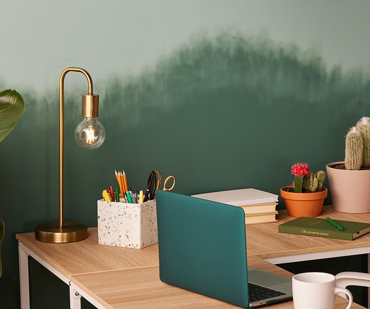 Brass desk lamp with transparent globe