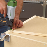 Install decorative mouldings on the storage chest