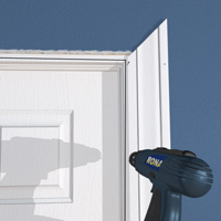 Position the moulding on the reveal line and drill small holes