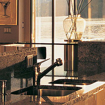Undermount stainless kitchen sink in a granite or stone countertop