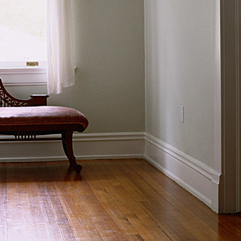 Baseboard trim complete the flooring installation. 