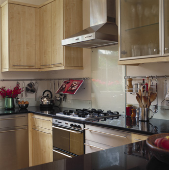 Rods and bars under wall cabinets to hang utensils and other objects