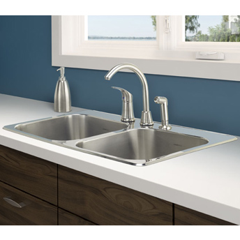 Stainless steel kitchen sink on laminate countertop
