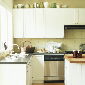 White kitchen with brick backsplash