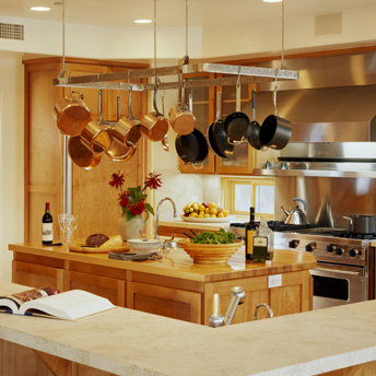 A pot rack above the island is both stylish and practical 